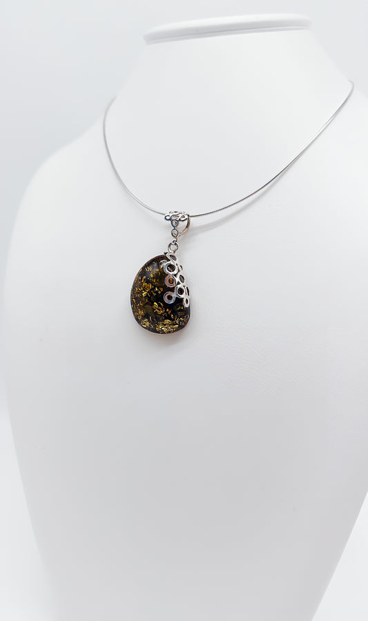 Amber Murmuration: Elegant silver pendant