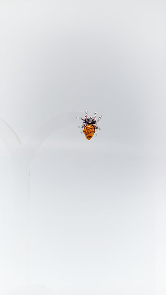 Fascinating spider earrings with amber and silver