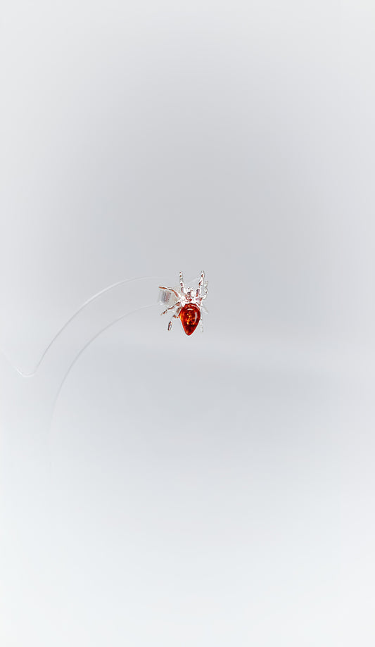 Mystical spiders with golden amber