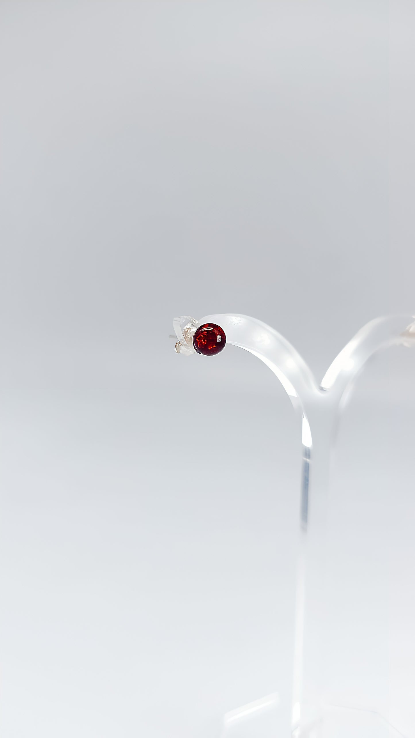 Delicate elegance: round amber stud earrings