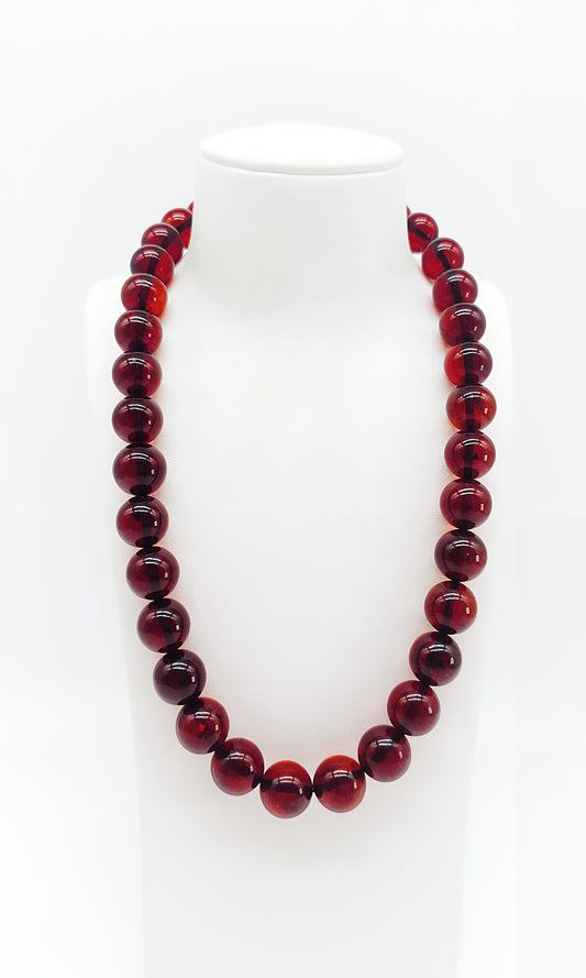 Deep red: unique piece made of precious amber