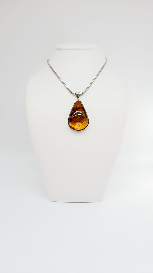 Radiant shine: Amber pendant in silver