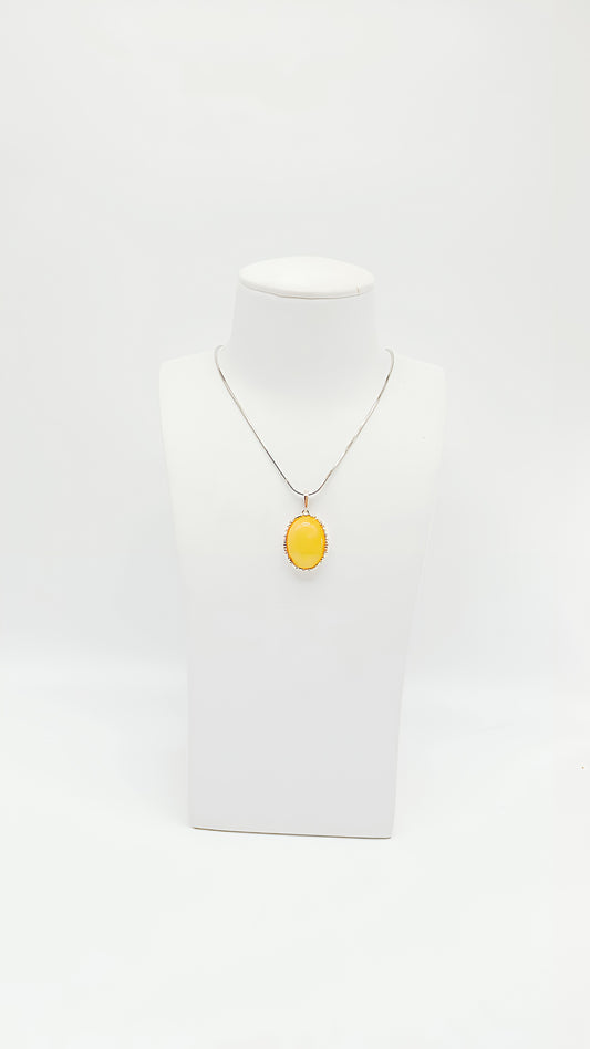 Radiant shine: amber in a silver frame