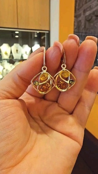 Elegant earrings made of 925 sterling silver with colorful amber