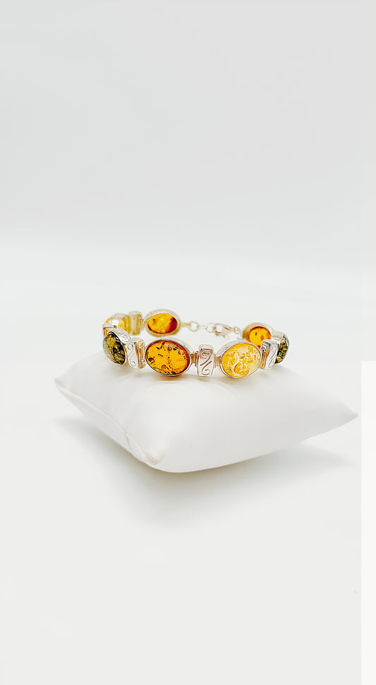 Exclusive amber: silver bracelet with colorful stones