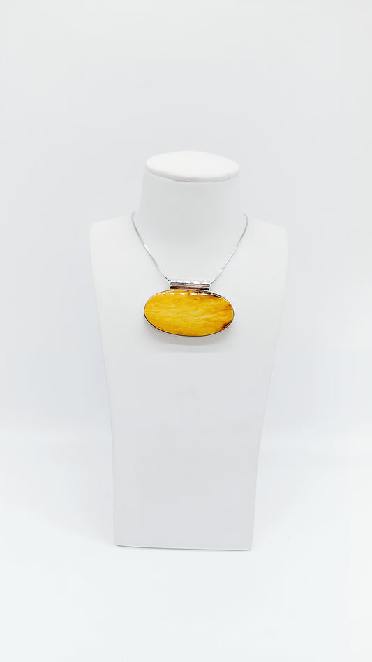Amber in a noble design: Unique pendant