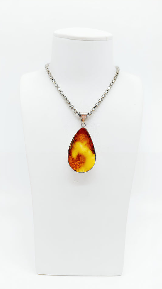 Women's jewelry pendant made of genuine amber