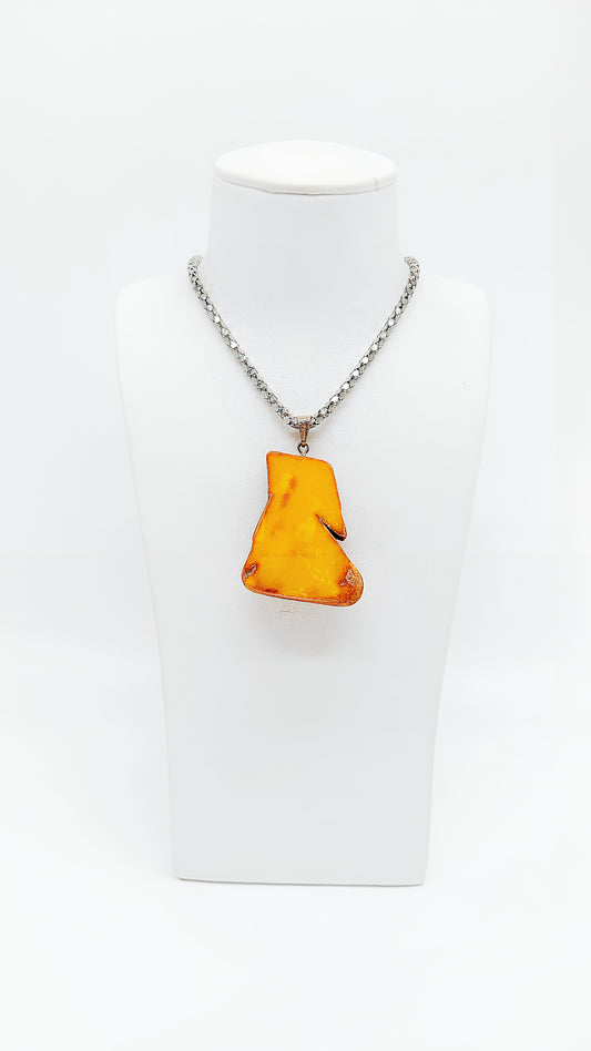 Unique amber pendant made of 925 silver in natural design