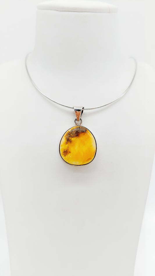 Amber pendant truly unique with silver for elegant looks
