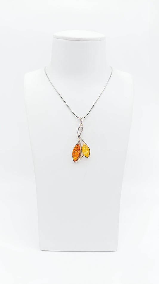 Play of colors in nature: amber pendant in silver