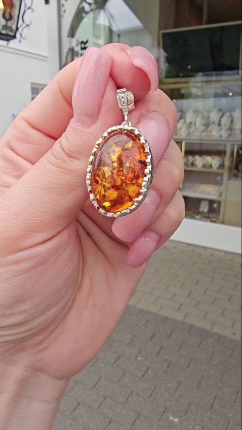 Silver earrings with bright amber
