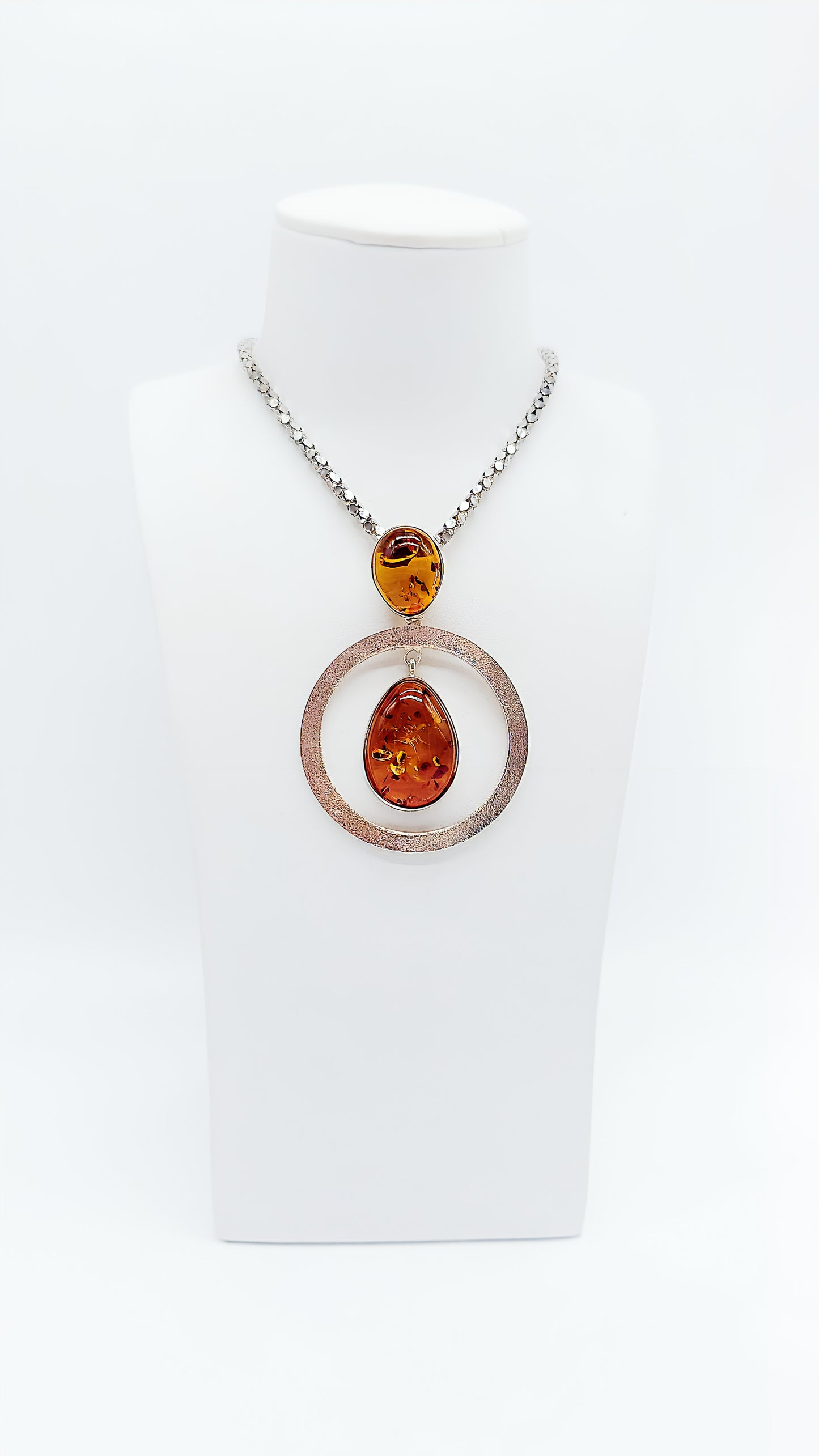 Artistic elegance: unique amber pendant in silver