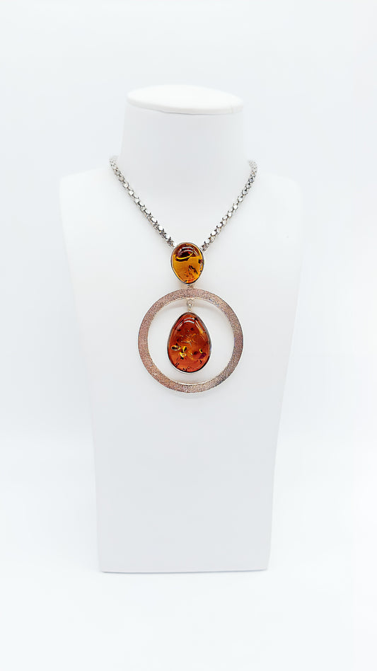 Artistic elegance: unique amber pendant in silver