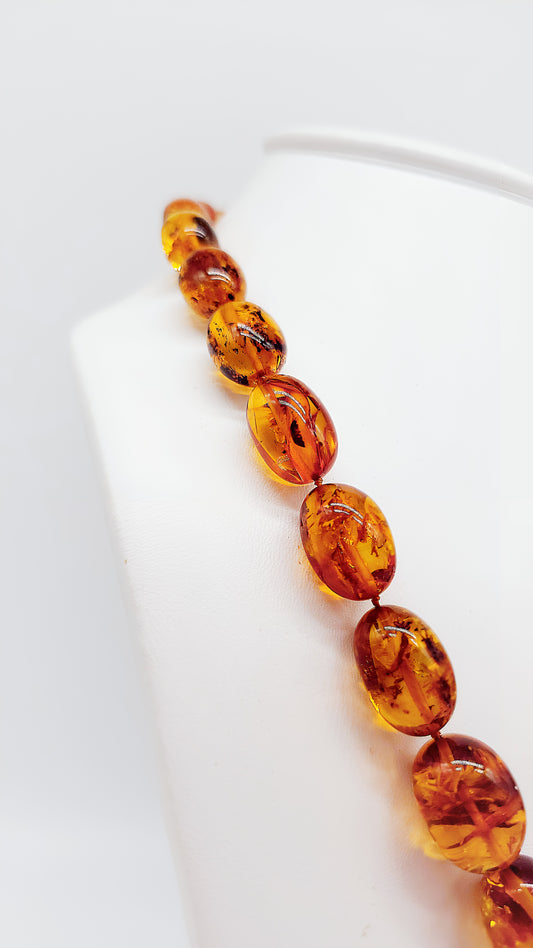 Luminous amber necklace with genuine natural stone