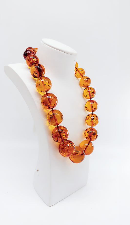 Shiny amber balls: unique piece of jewelry