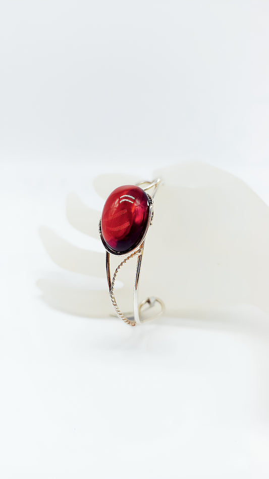 Radiant red amber in precious silver