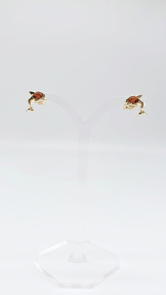 Elegant dolphin: amber in a golden design