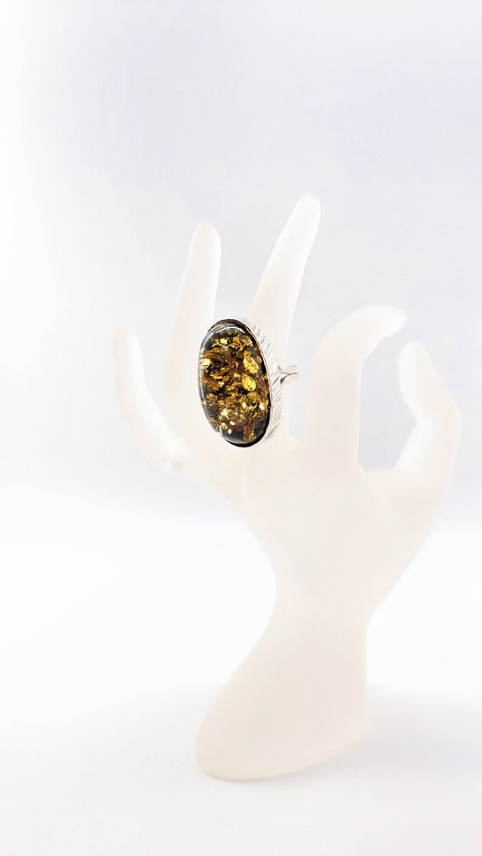 Radiant amber in a silver ring