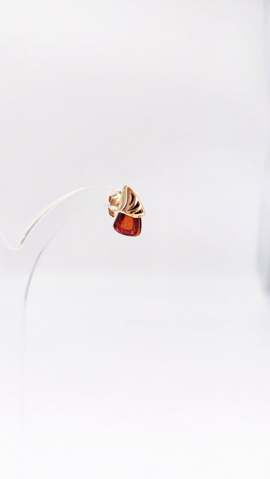 Gold-plated earrings with a modern triangle design and amber