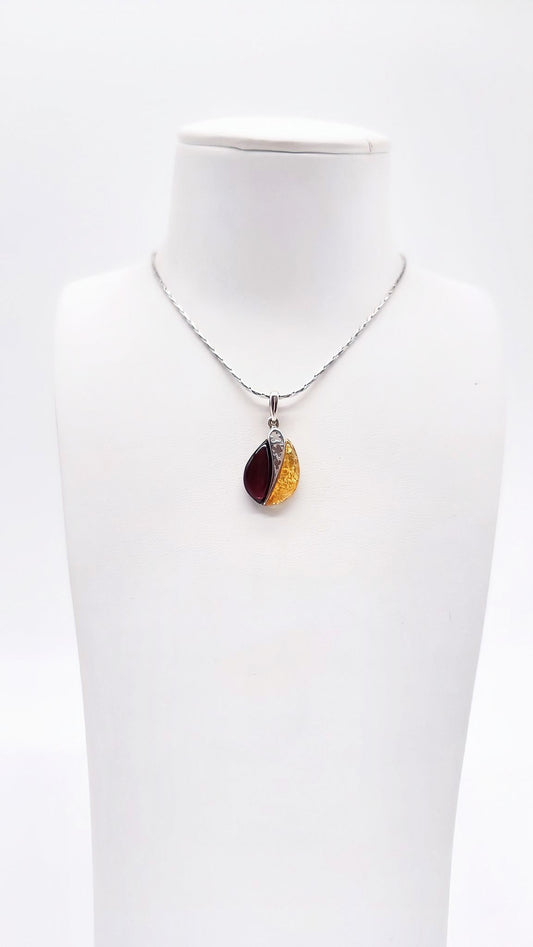 Two-tone natural amber in an artistic silver setting