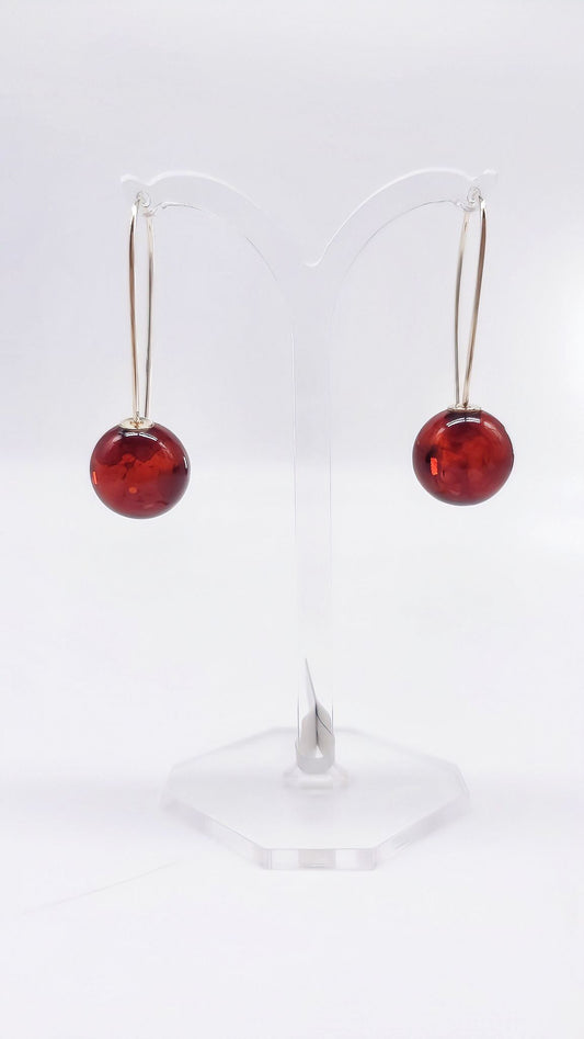 Modern jewelry design – red amber & silver setting
