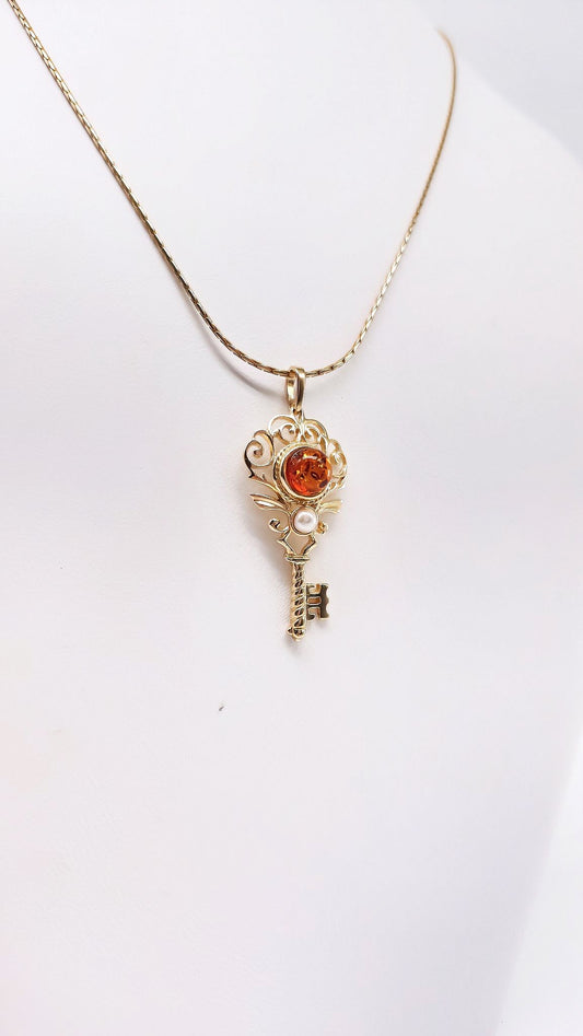 Vintage key pendant with gold-plated silver