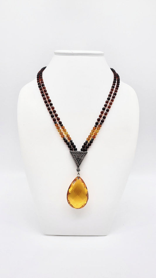 Statement necklace with large amber pendant