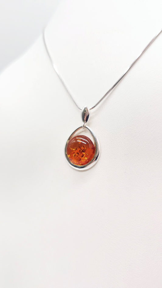 Classic pendant made of 925 silver with orange amber