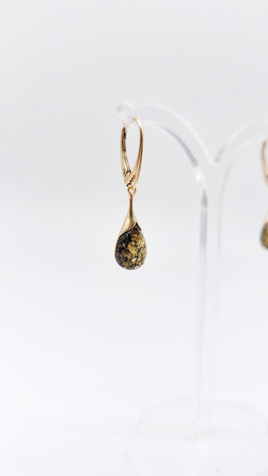Golden earrings with green amber