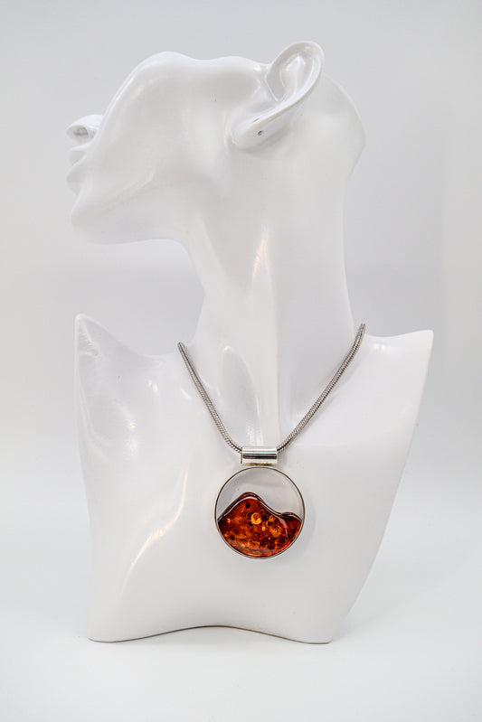 Unique pendant made of silver with amber