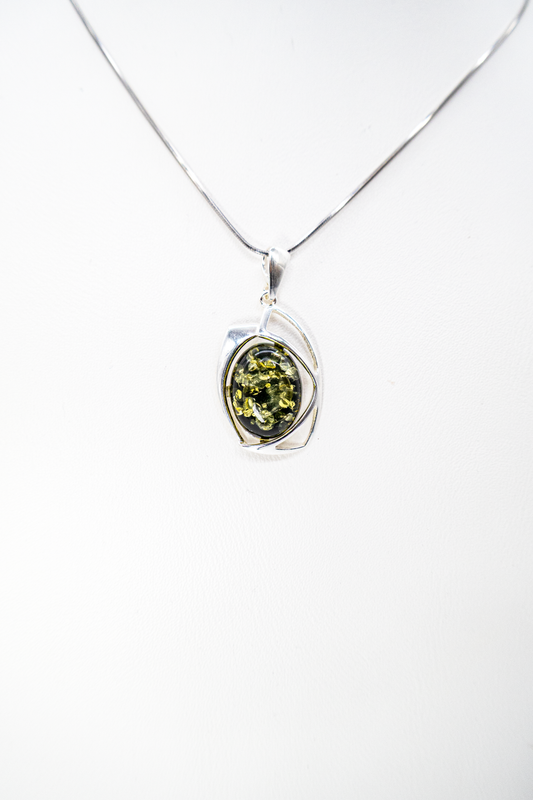 Green natural amber in a stylish silver setting