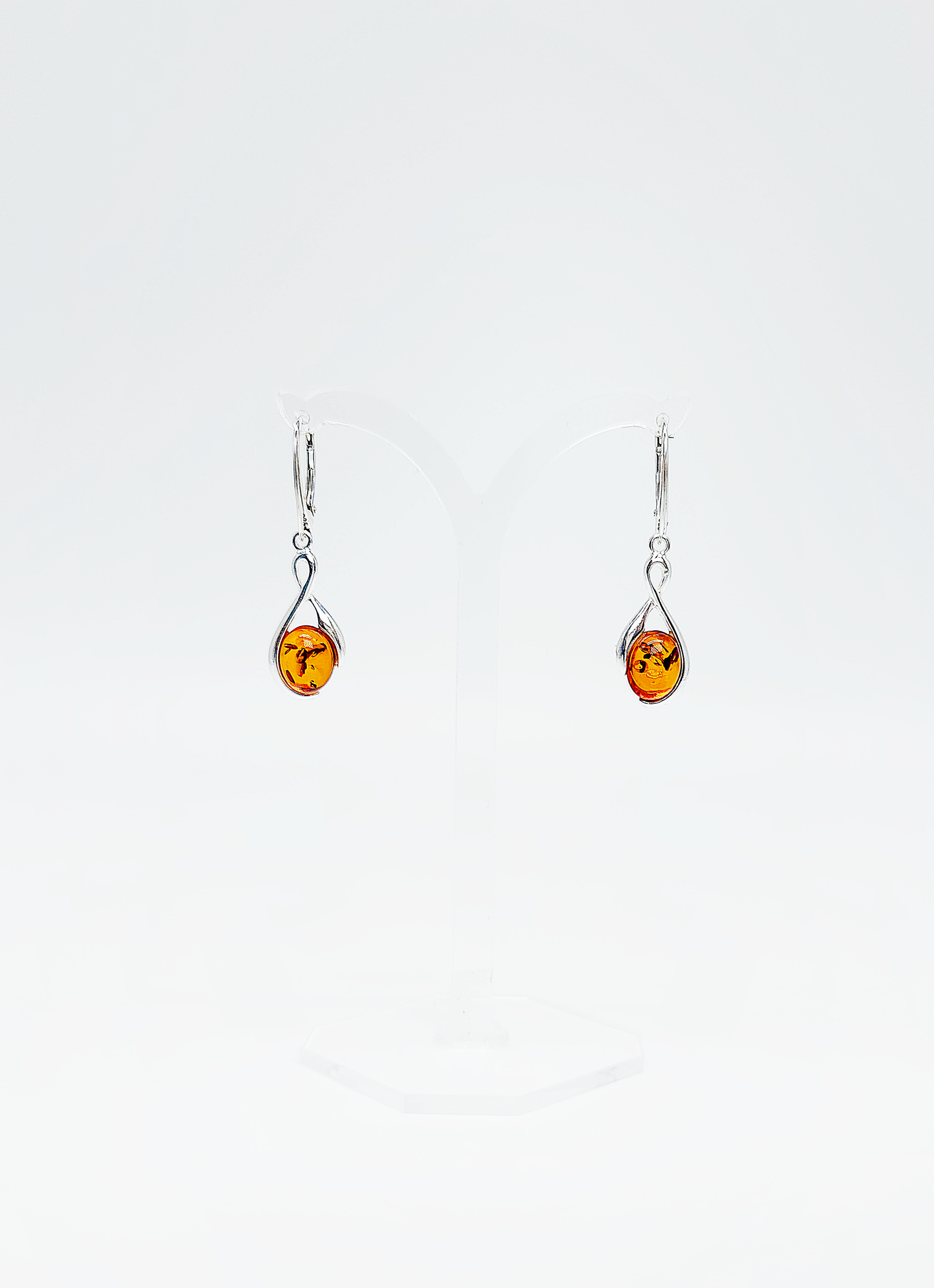 Modern rhombus amber earrings in silver