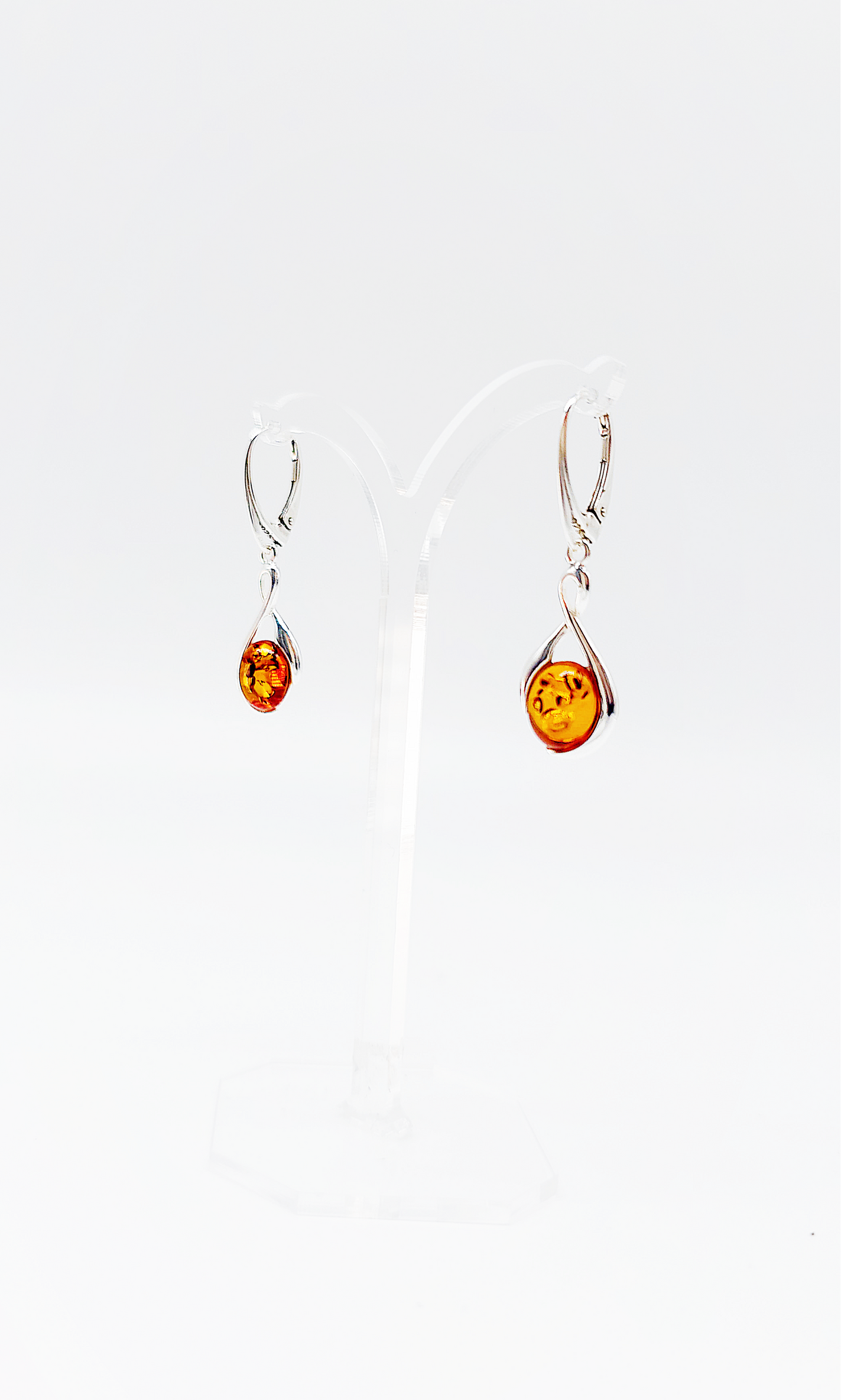 Modern rhombus amber earrings in silver