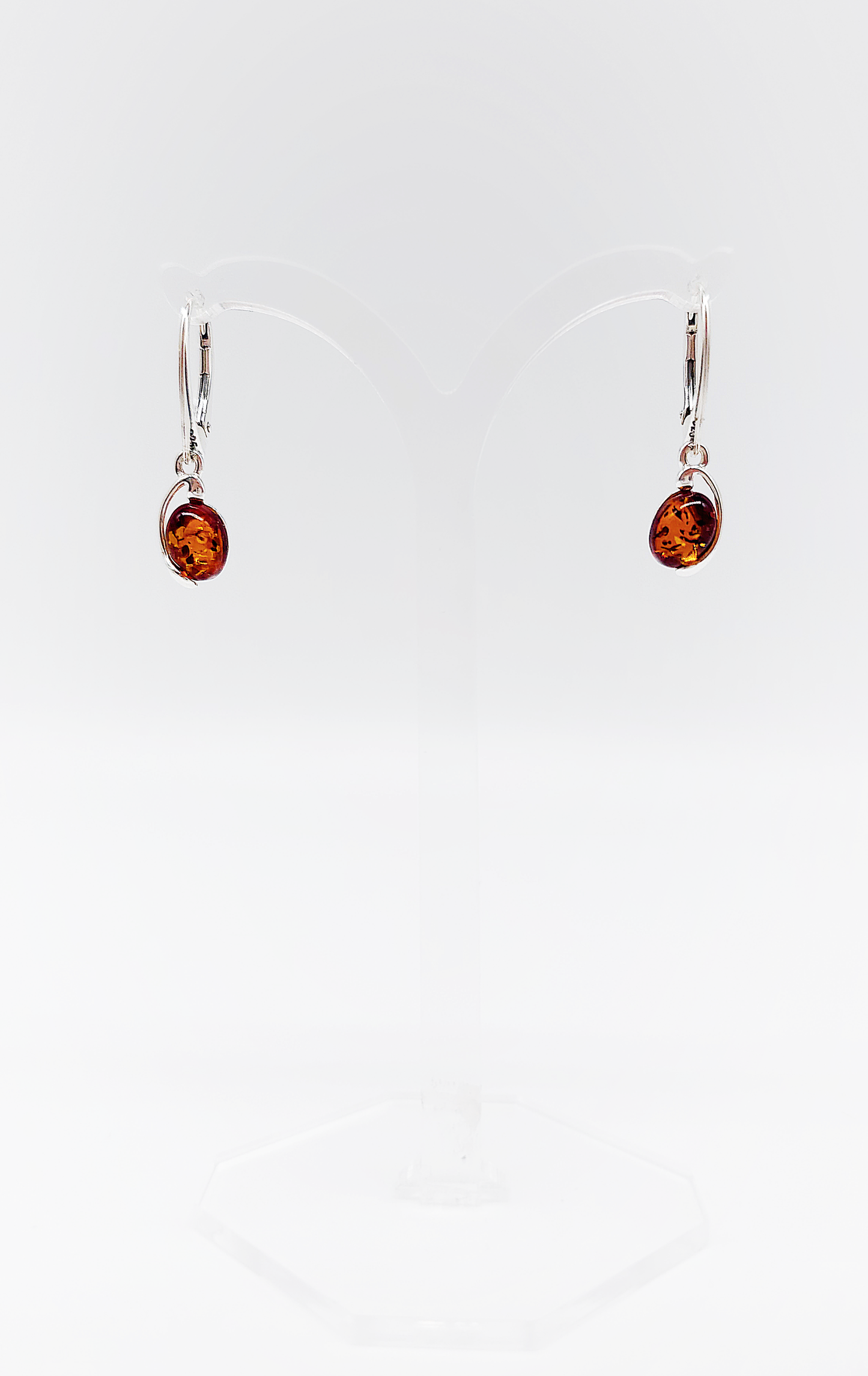 Classic silver and amber earrings in oval shape