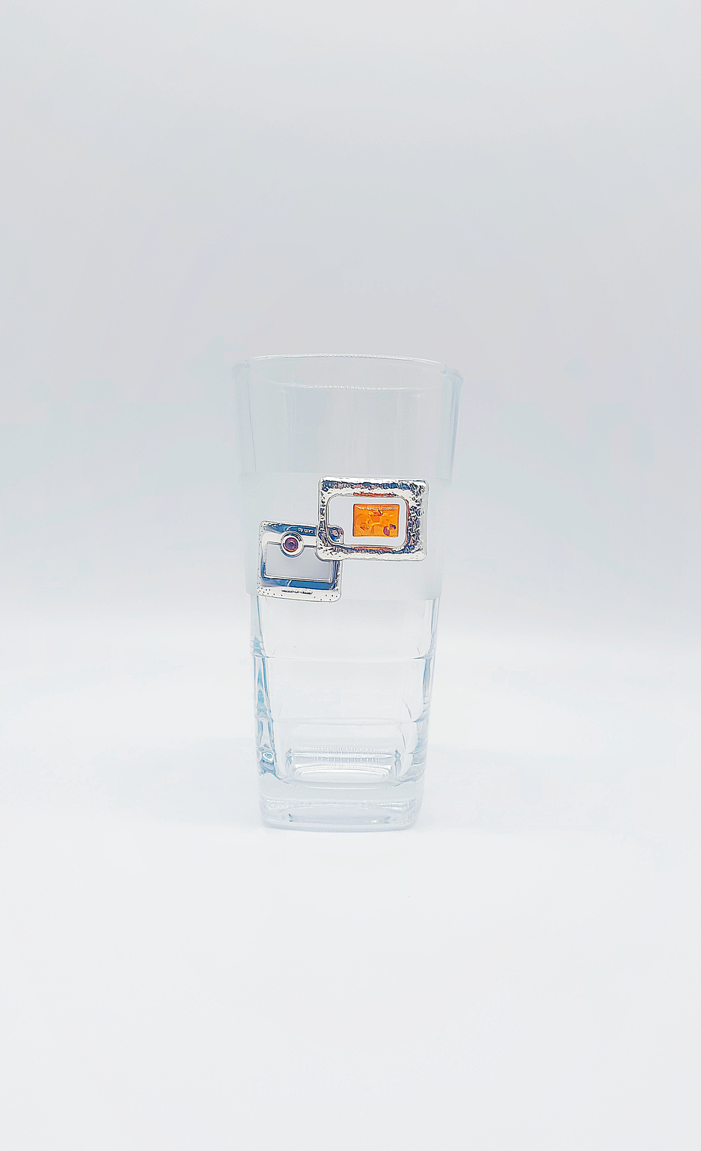Elegant water glass with amber and silver decoration