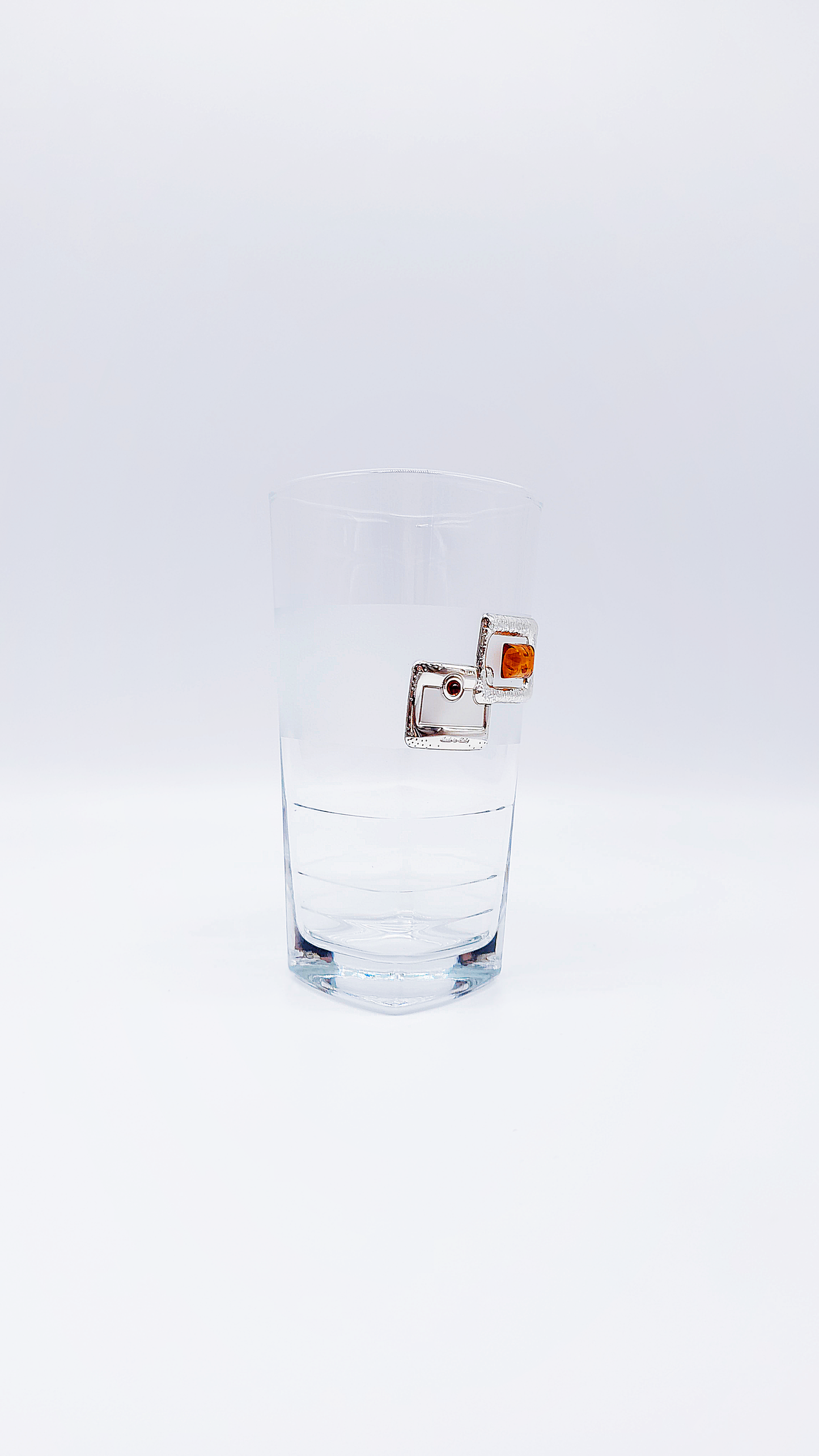 Elegant water glass with amber and silver decoration