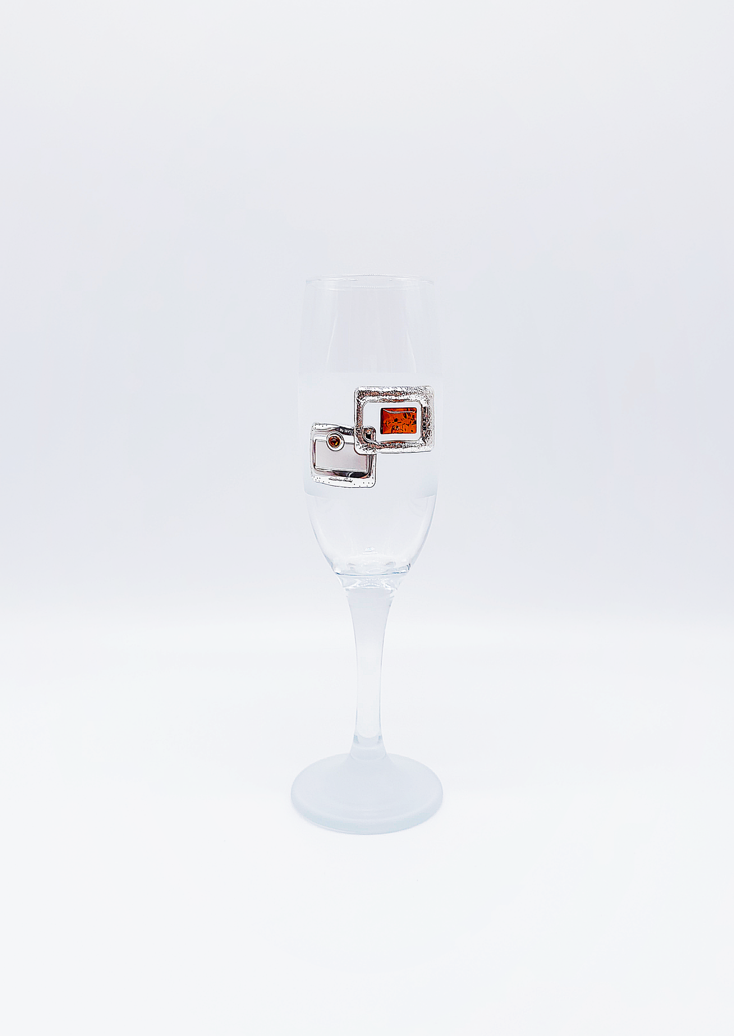 Exclusive glass with amber and silver decoration