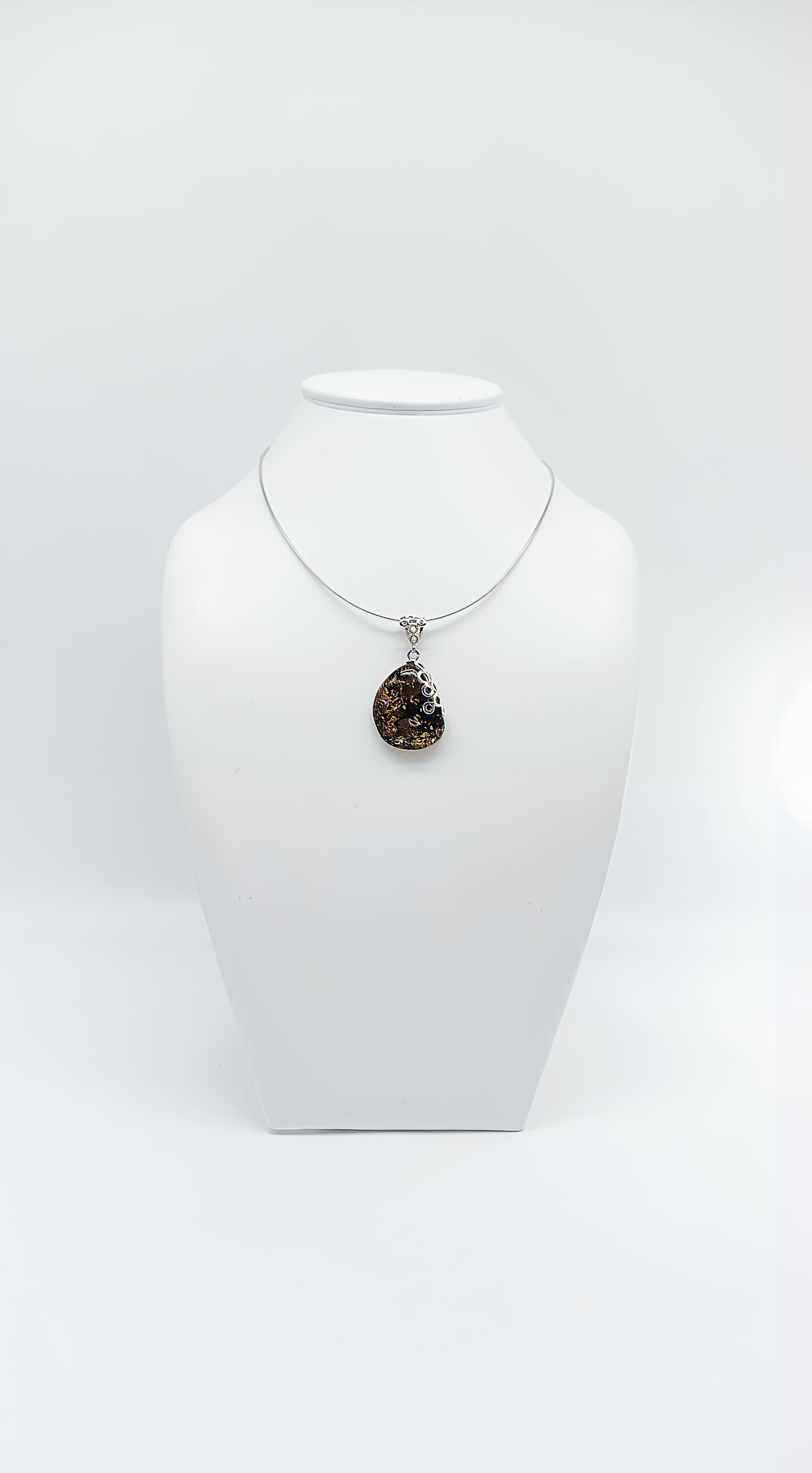 Amber Murmuration: Elegant silver pendant