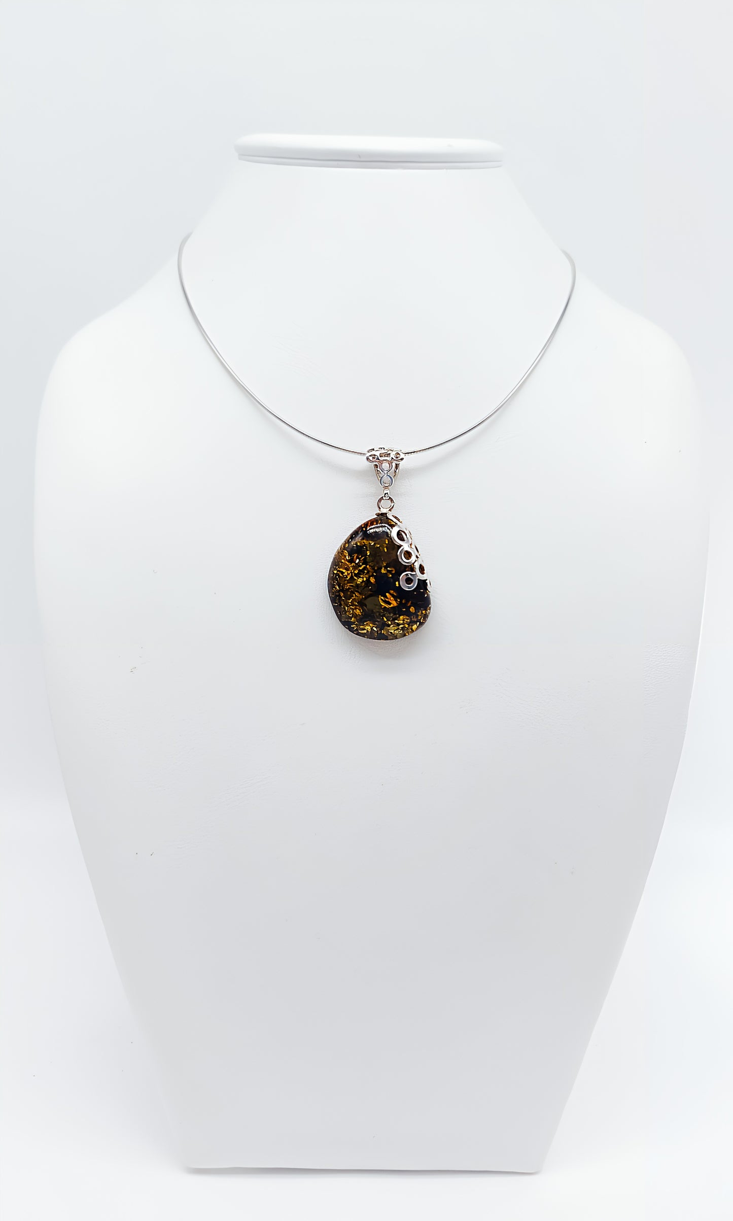 Amber Murmuration: Elegant silver pendant