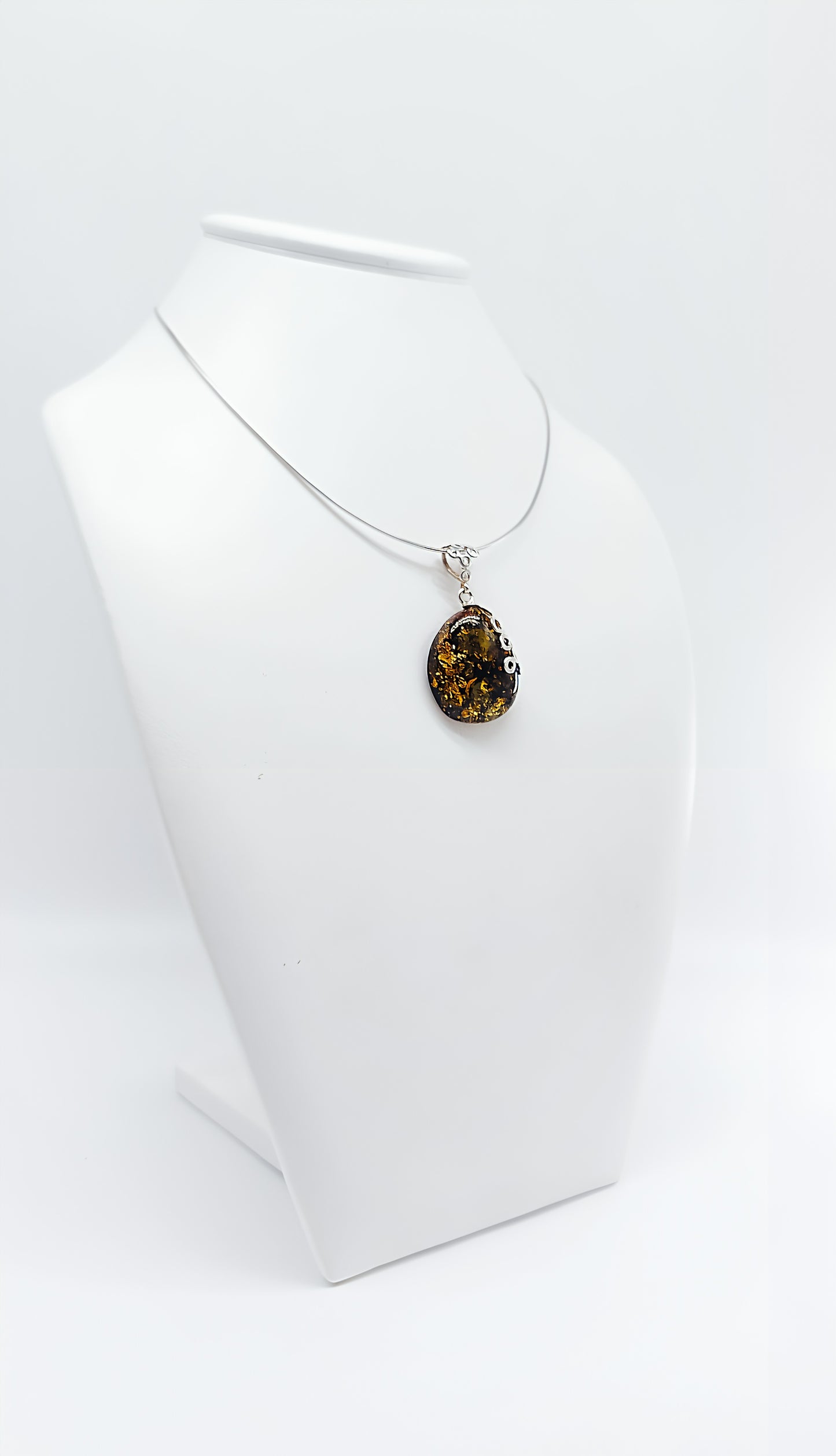 Amber Murmuration: Elegant silver pendant