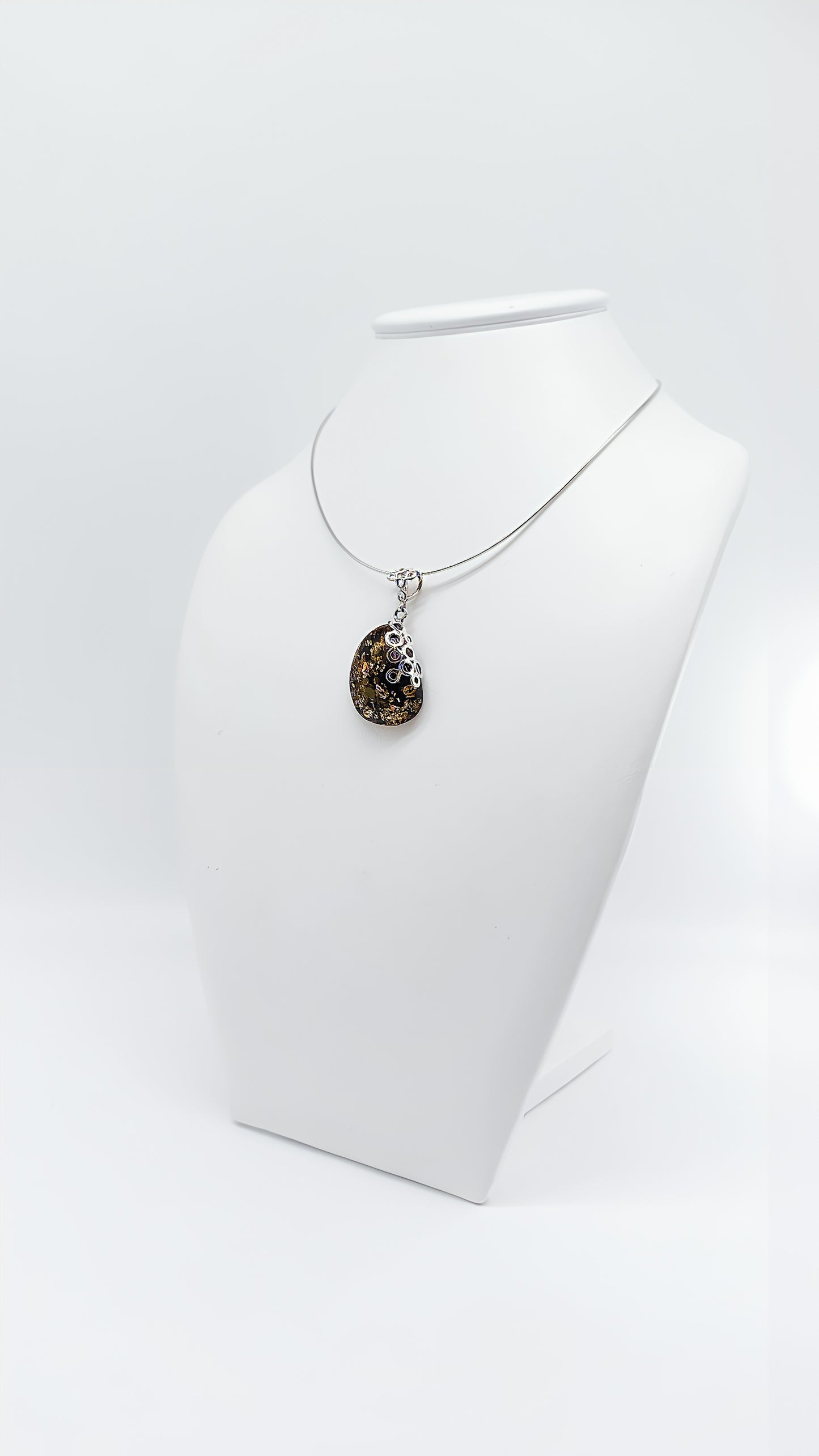Amber Murmuration: Elegant silver pendant