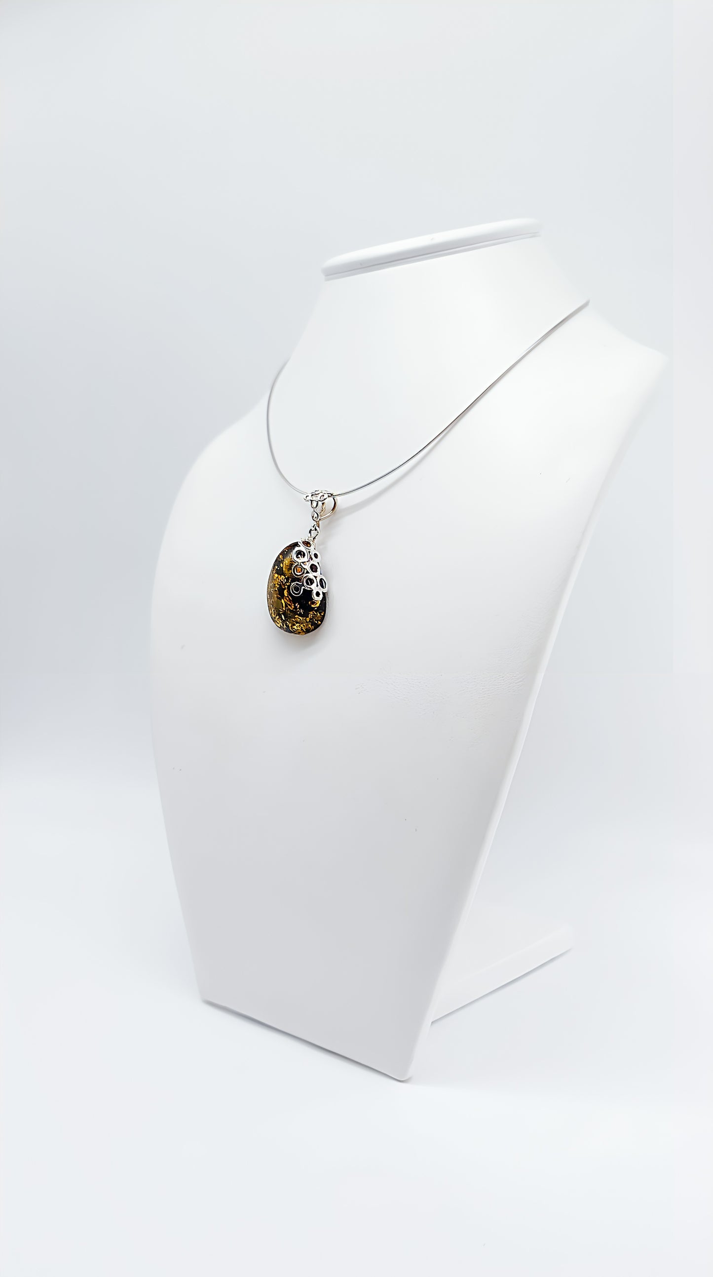 Amber Murmuration: Elegant silver pendant