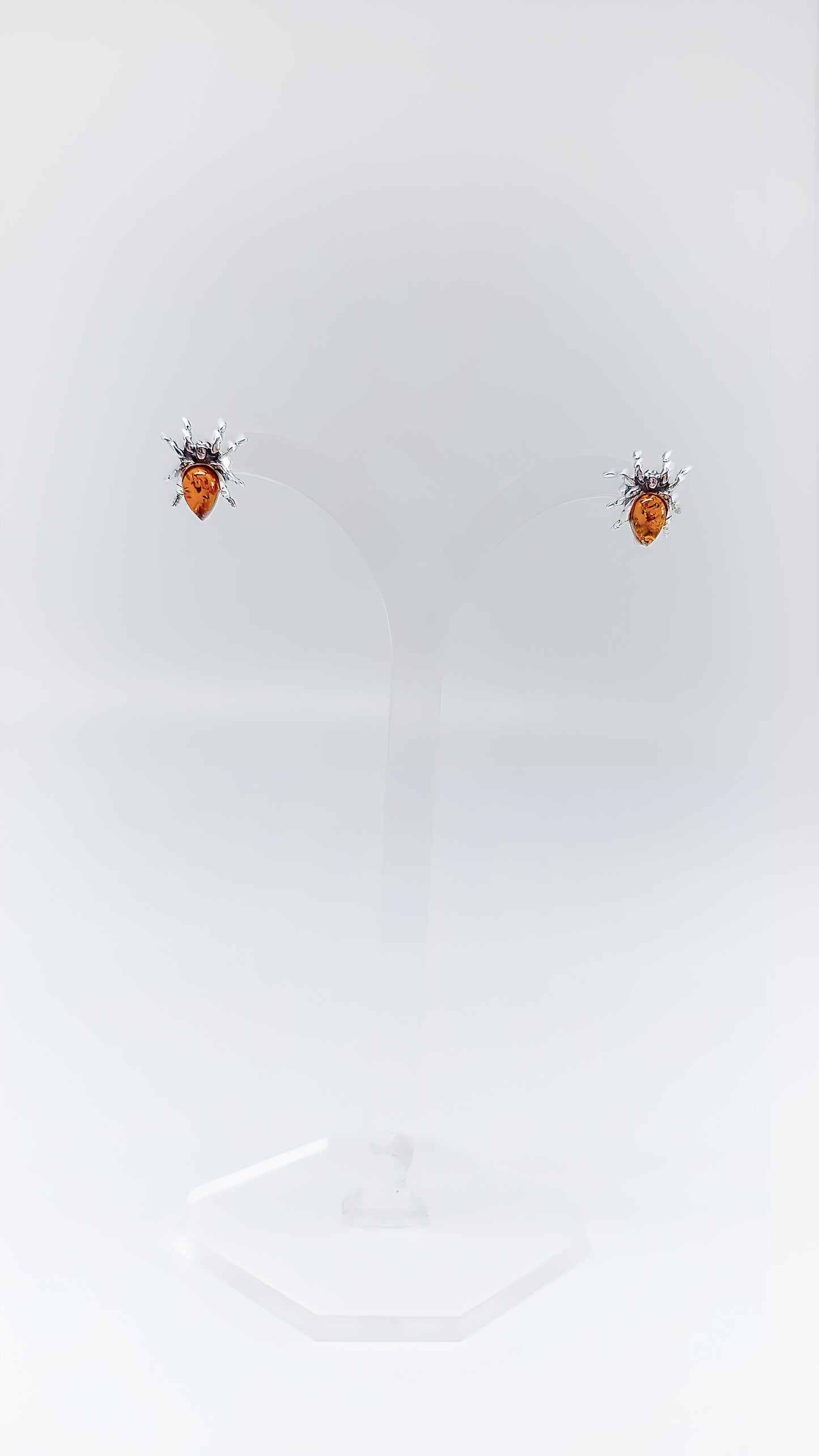 Fascinating spider earrings with amber and silver