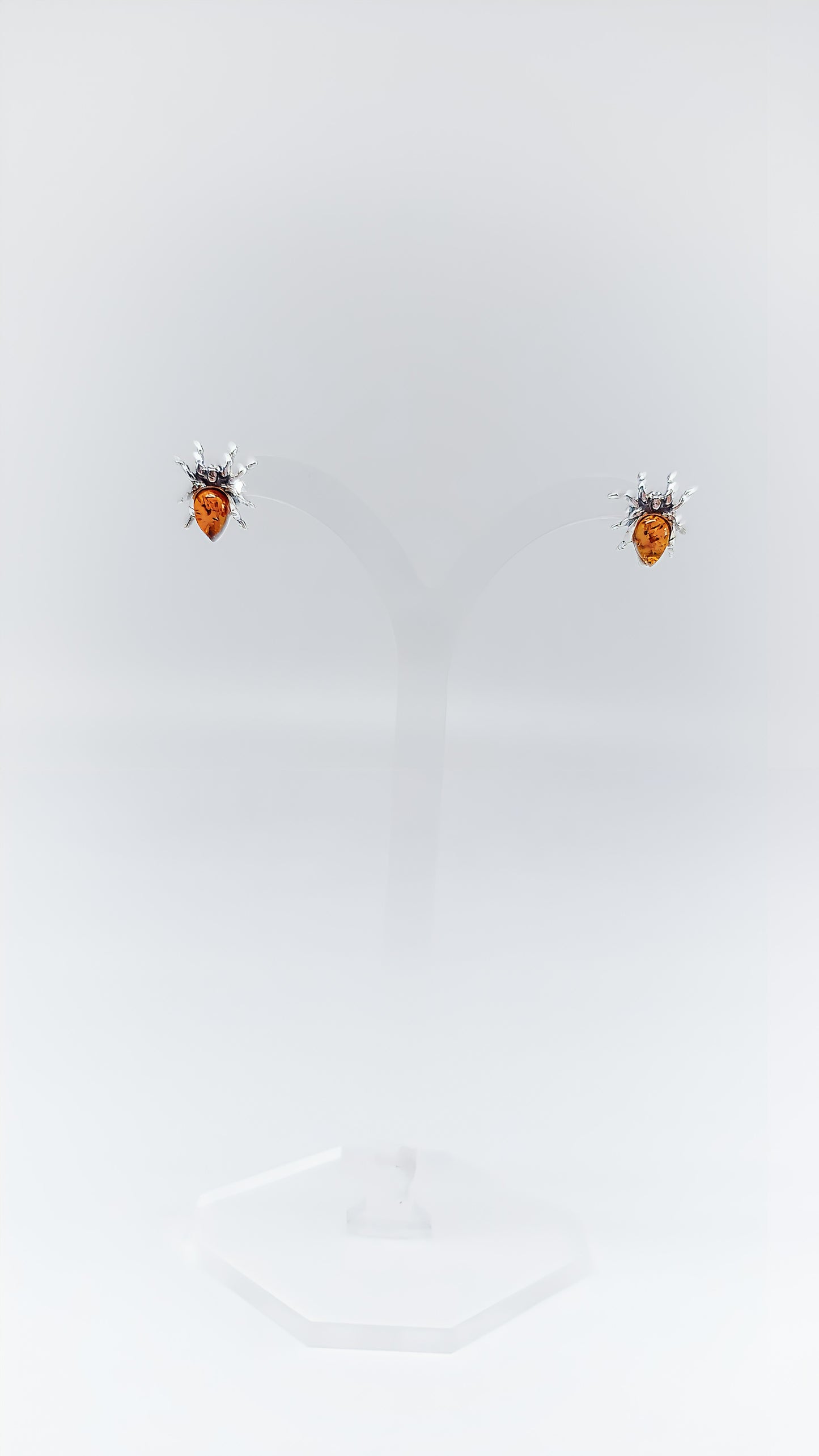 Fascinating spider earrings with amber and silver