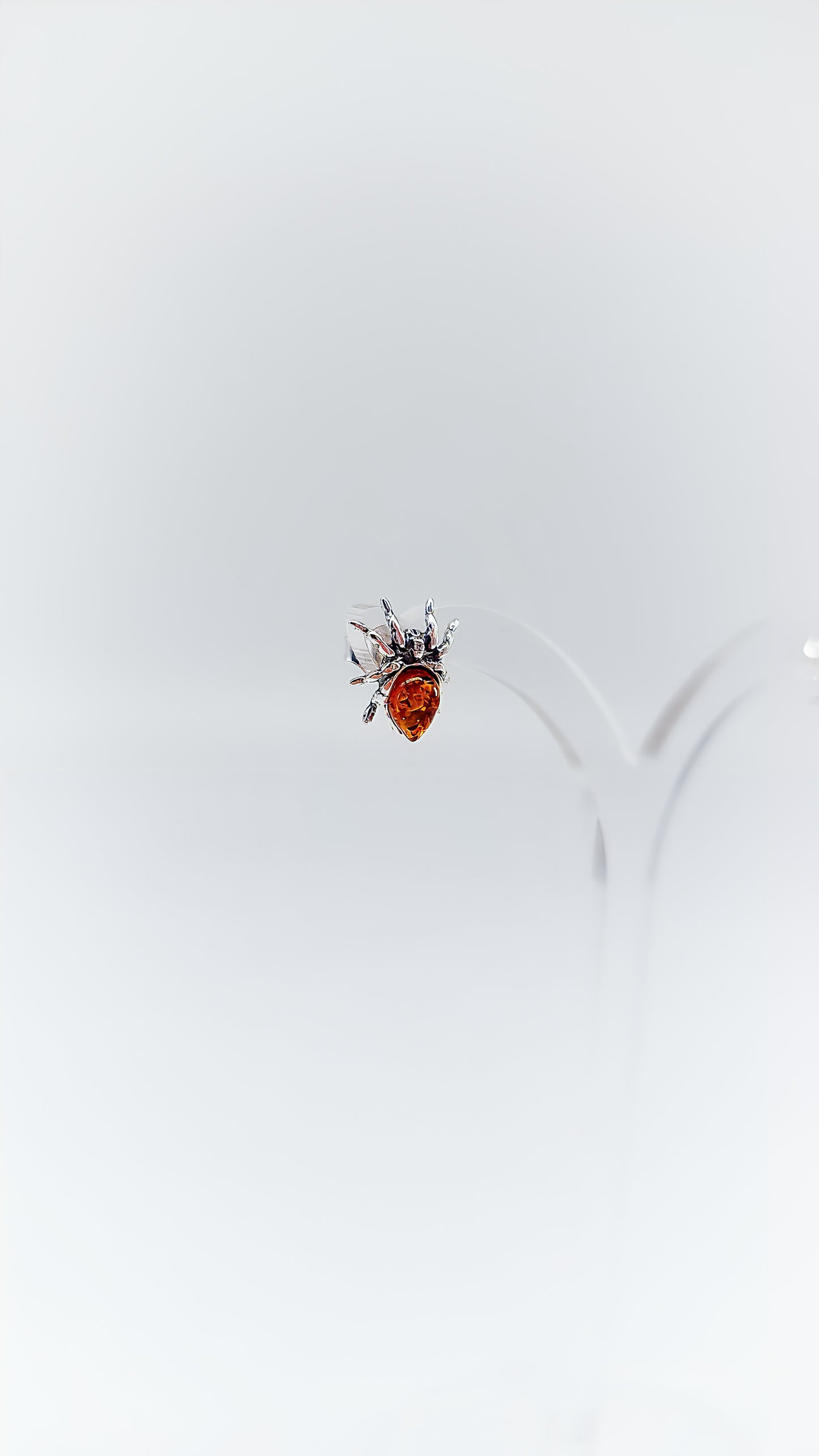 Fascinating spider earrings with amber and silver