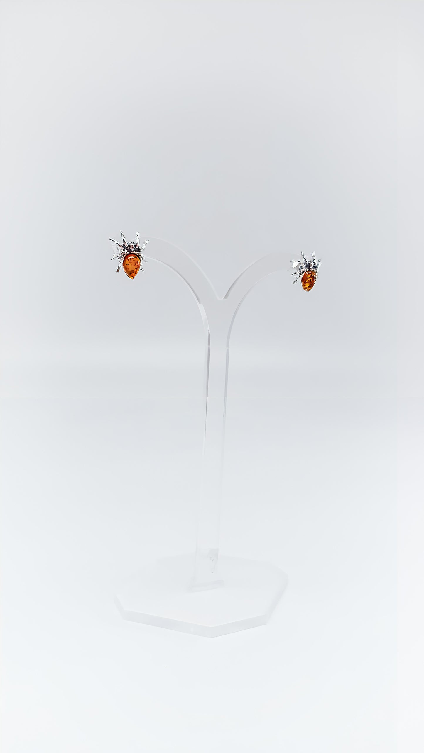 Fascinating spider earrings with amber and silver