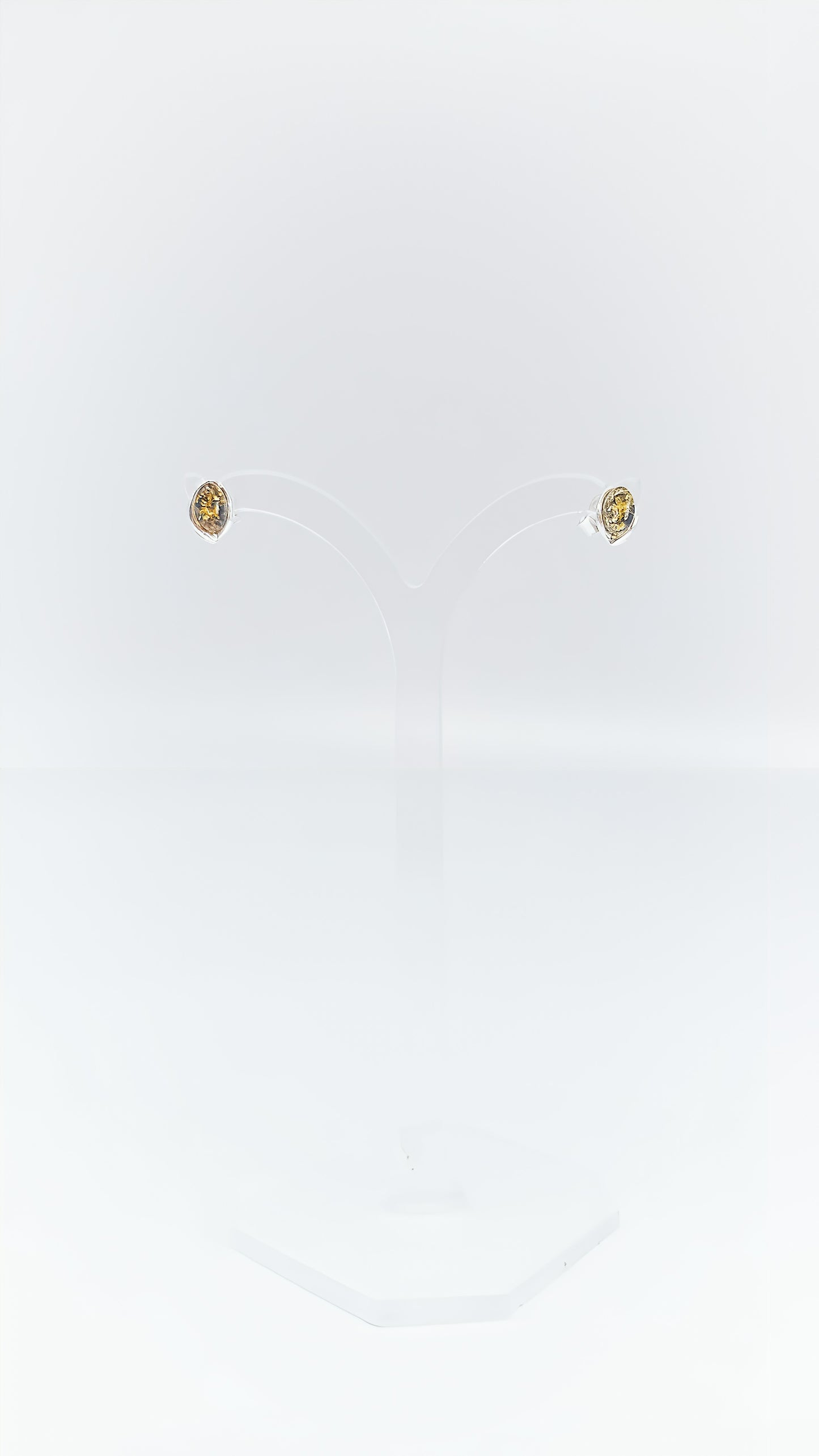 Oval amber earrings in a silver frame