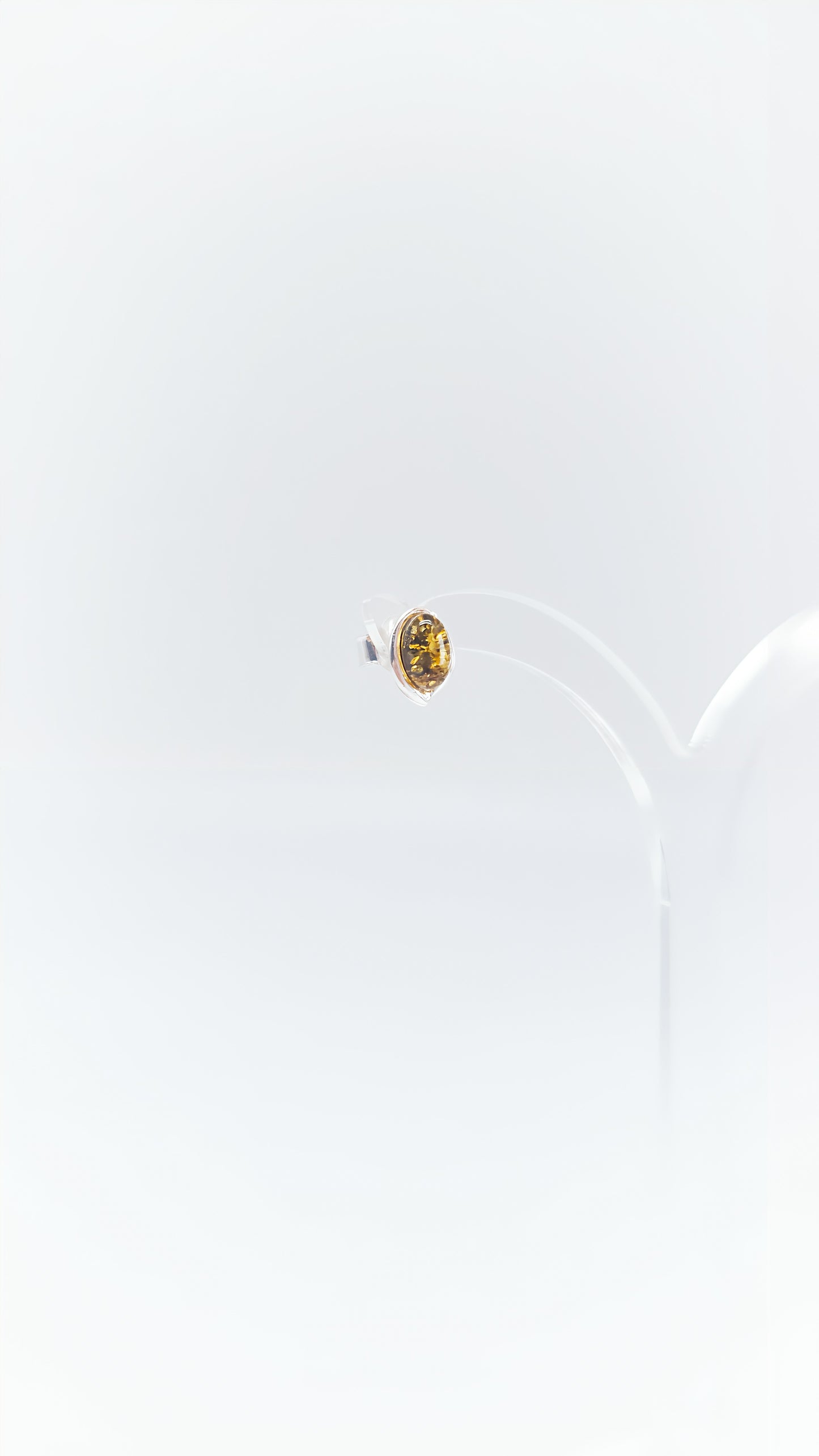 Oval amber earrings in a silver frame
