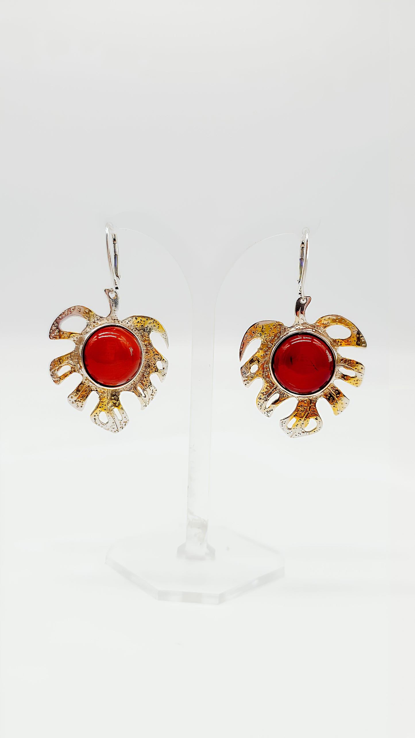 Gold-plated leaf design with bright amber