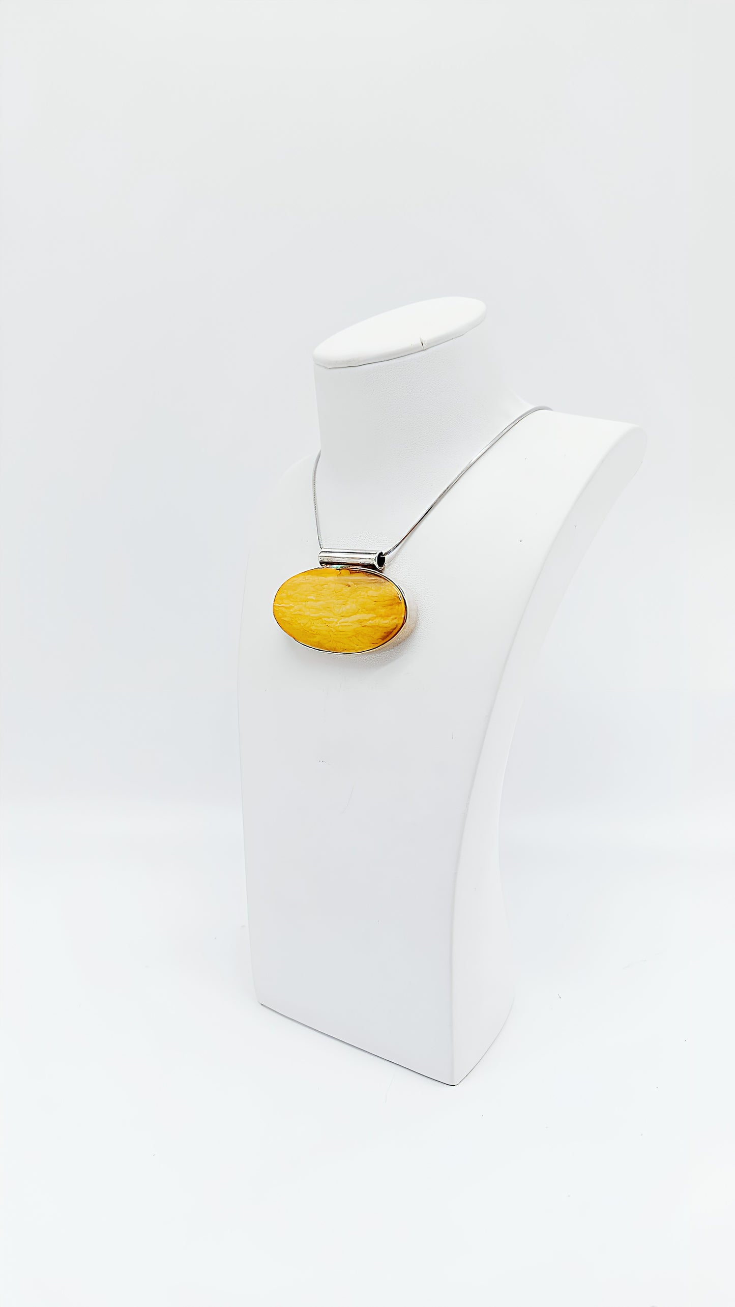 Amber in a noble design: Unique pendant